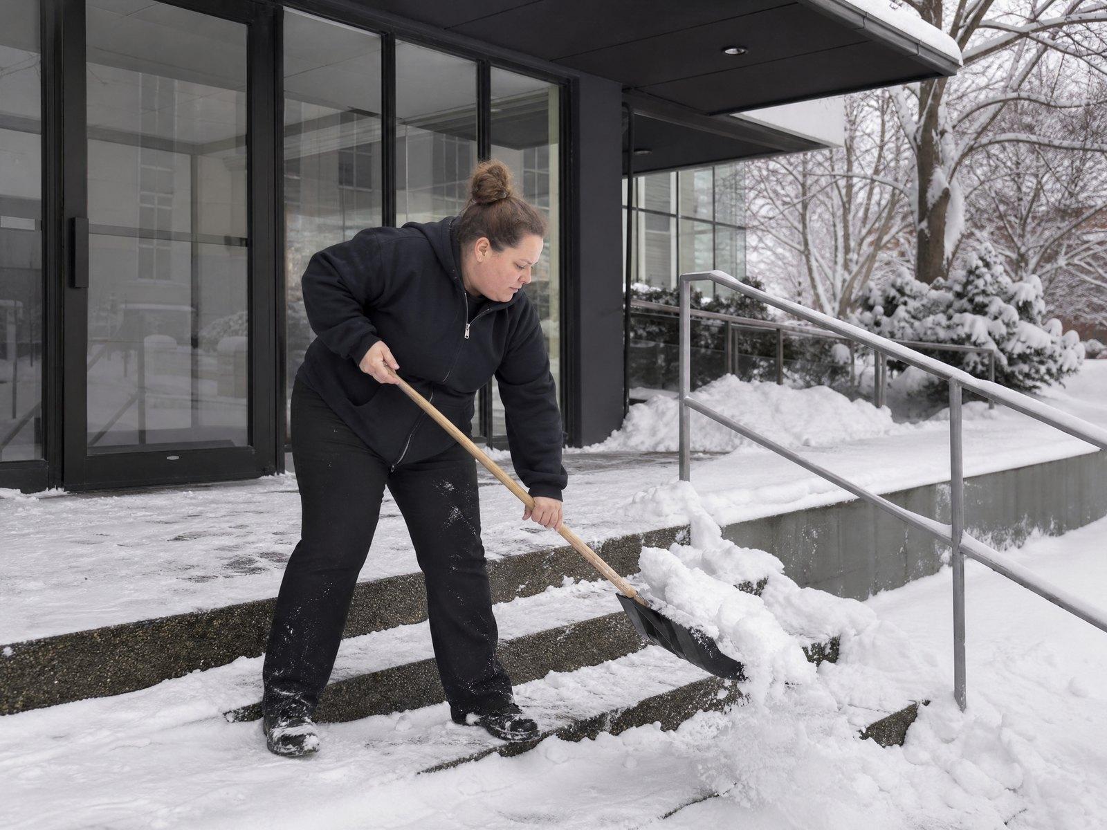 Shovelling office entrance steps